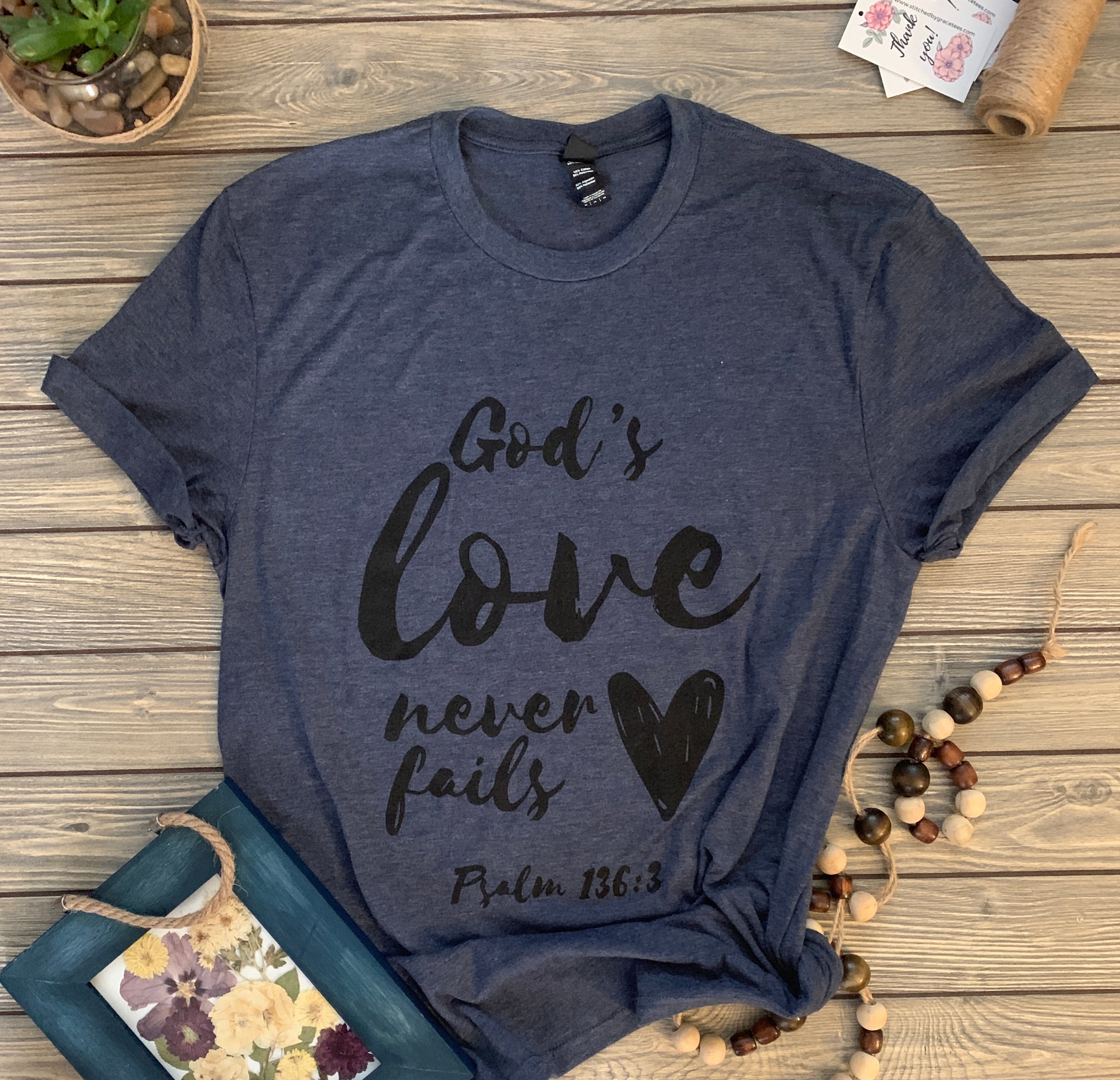 God's Love Never Fails (Heathered Navy)